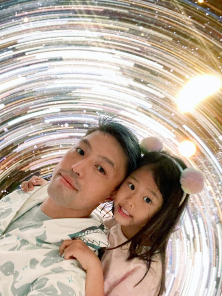 Ryan Sun and his daughter at an NFT event
