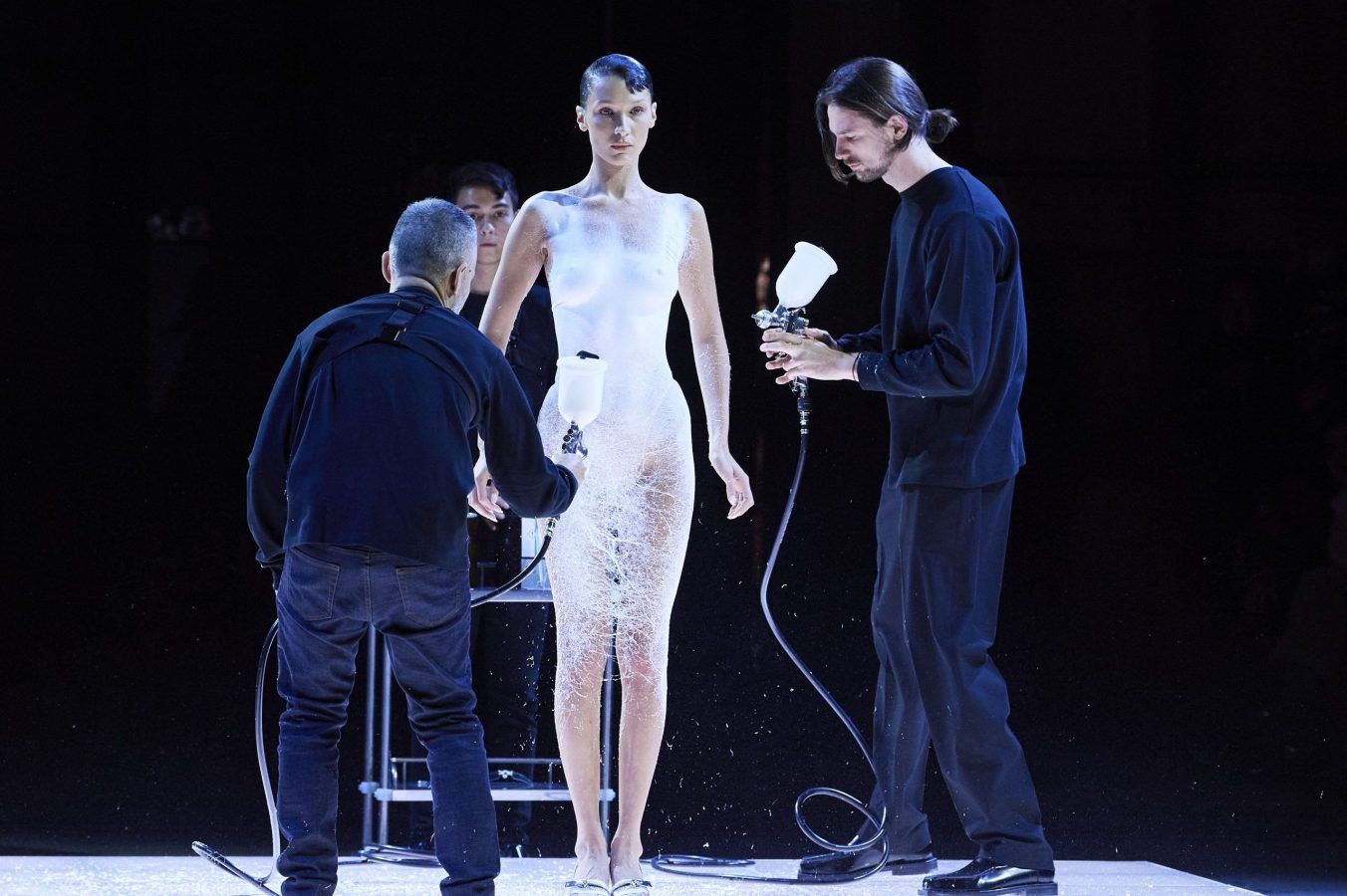 Bella Hadid gets dress spray-painted on mid-fashion show
