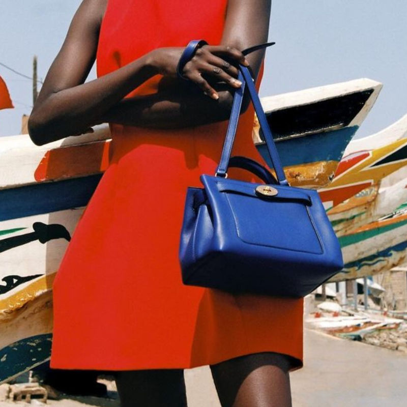 a model holding a mulberry islington handbag as an hermes birkin style bag alternative