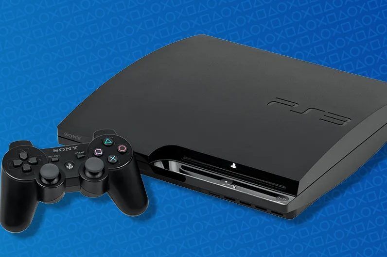PS3 console and controller in front of a blue background