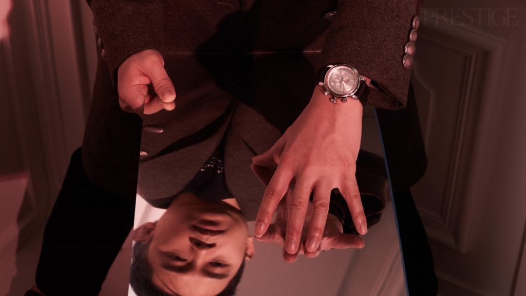 Vincent Lua wears Brunello Cucinelli coat and t-shirt; Bottega Veneta pants; Chopard Mille Miglia Chronograph in stainless steel