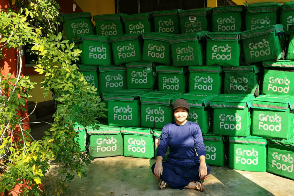 Upcycling used Grabfood delivery bags into school bags, pencil cases and purses for poor kids