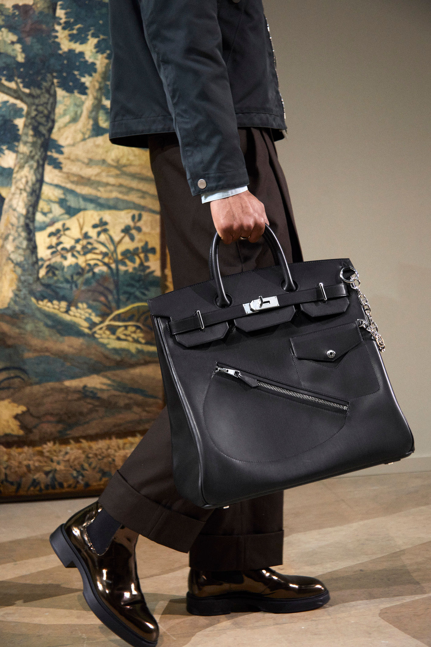 how an hermes kelly bag should be carried by a man.